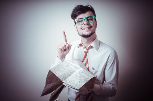 lost businessman with map on gray background