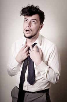 stressed businessman on gray background