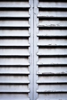 Close up of weathered wooden window shutters