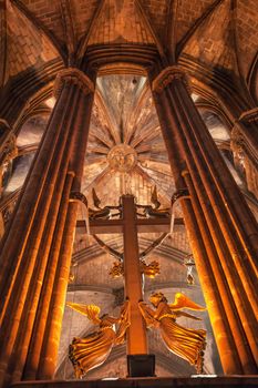 Cross Angels Stone Columns Arches Gothic Catholic Barcelona Cathedral Basilica in Catalonia, Barcelona, Spain.  Cathedral built in 1298.