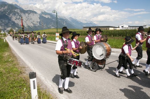 AXAMS,AUSTRIA - AUGUST 15:Unidentified people making music in procession to the church on Maria Ascension,on August 15, 2012 in Axams, Austria. Maria Ascension is the annual christian celebration in Axam