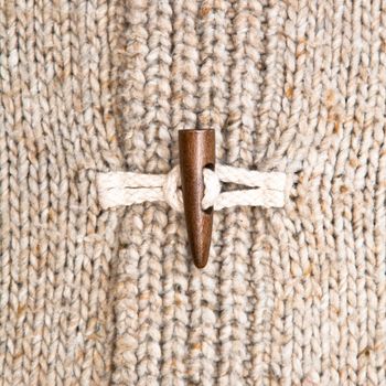 Close up of the toggle on a warm winter jumper