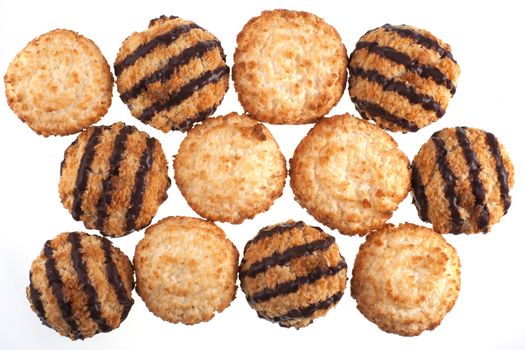 Group of plain and chocolate coconut macaroons on white background