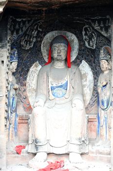 Ancient Buddha statue in caves in Sichuan, China