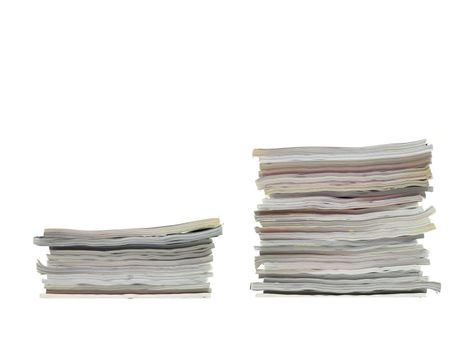 A stack of magazines isolated against a white background