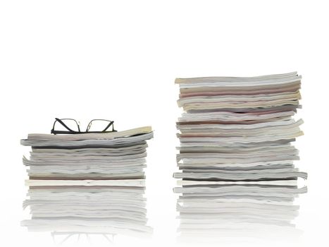 A stack of magazines isolated against a white background