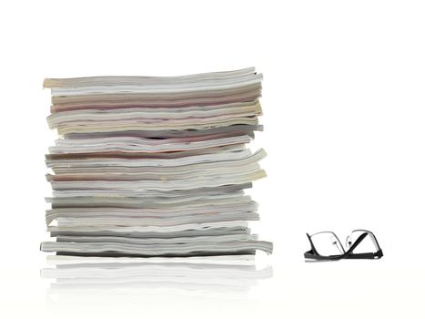 A stack of magazines isolated against a white background