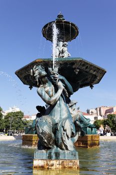 famous fountain on rossio square the liveliest placa in Lisbon 