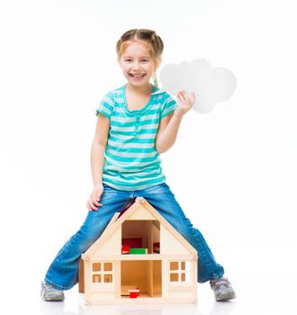 girl standing over the toy house with cloud talk