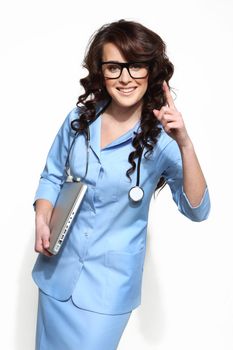 Isolated woman doctor carrying a laptop on white background