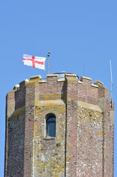 Top of castle tower with george cross flag