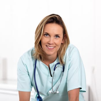 portrait of blond woman doctor in hospital