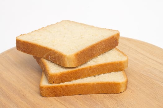Slices of bread on white background