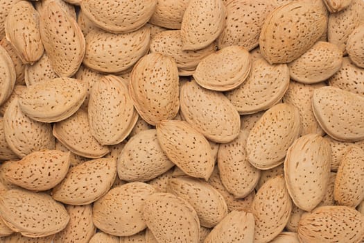 Pile of almonds close-up as background.