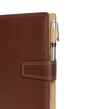 Leather notebook and pencil on white background.