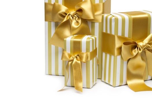 Gold gift boxes isolated on white background