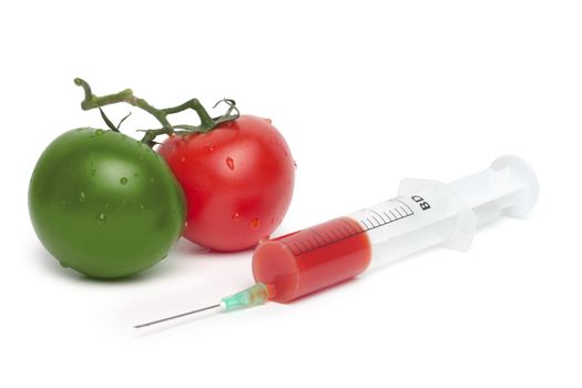 syringe and green with red tomatoes