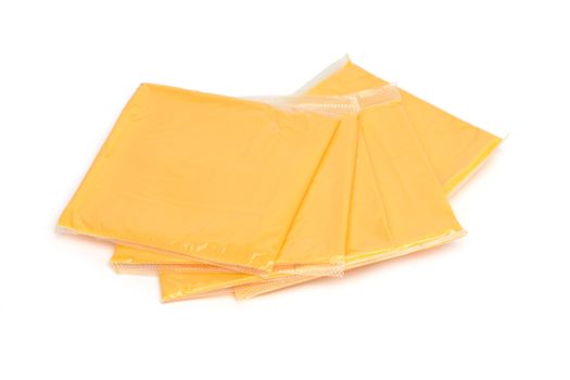 cheddar cheese slices on white background