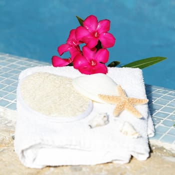 Spa setting with flower and white towel