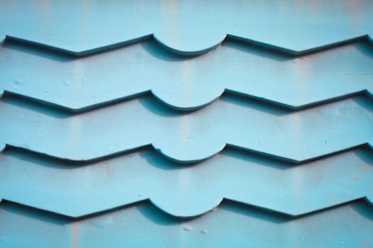 Blue wooden panels on an external wall as a background
