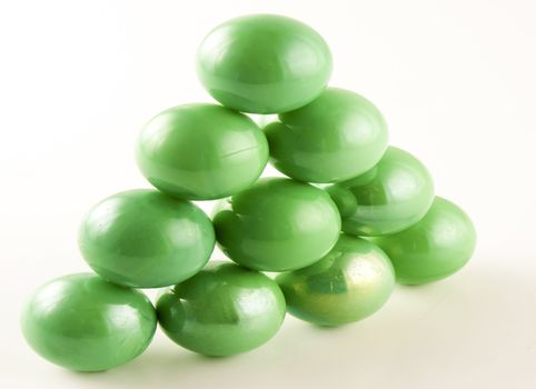 triangle of green marbles