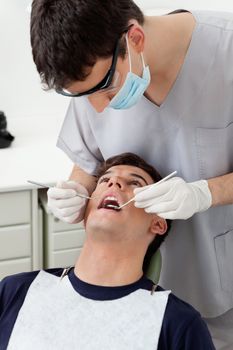 Dental hygienist working on patient's teeth