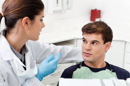 Man having consultation with female dentist