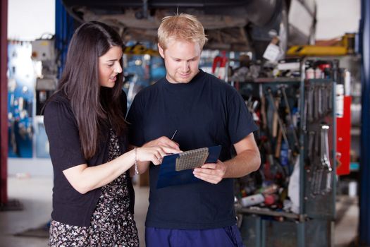 An upset customer disputing a repair report with a mechanic