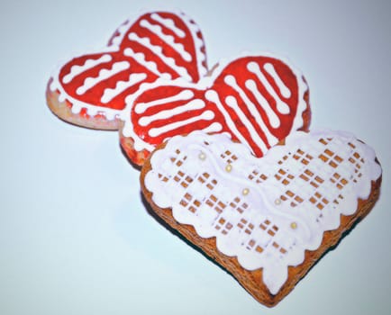 background with sugar glaze decorated gingerbread hearts