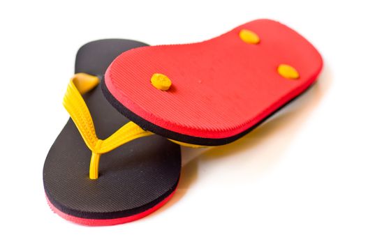 black and red slipper on white background