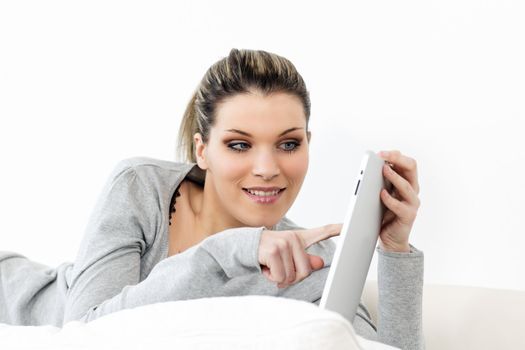 beautiful woman on sofa with tablet at home