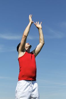 goal raising hand to heaven to catch the ball