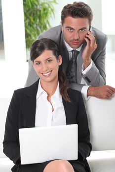 Two businesspeople in waiting area