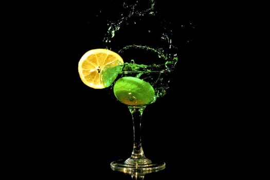 Green cocktail splash with a slice of citron