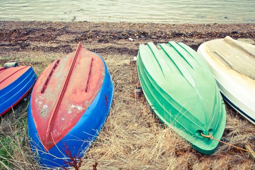 Upturned rowing boats on a pebble beach