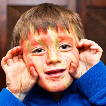 A five year old boy with face paint on