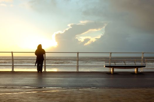 Silhouette of a person at the seafront promenade in Port Talbot, Wales