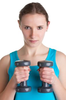 Woman working out with dumbbells at a gym, isolated in a white background