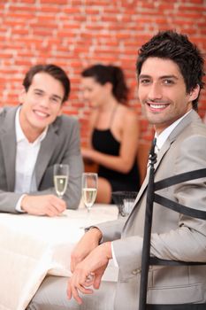 men drinking champagne