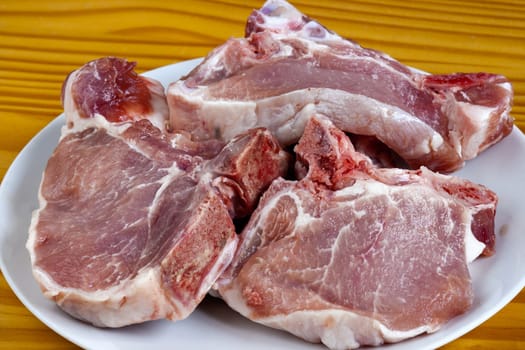 Detail of the raw pork chops - T-bone