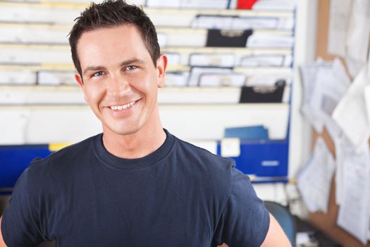 Portrait of a happy mechanic looking at the camera