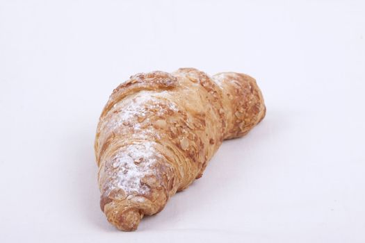 fresh almond croissant isolated on a white  background