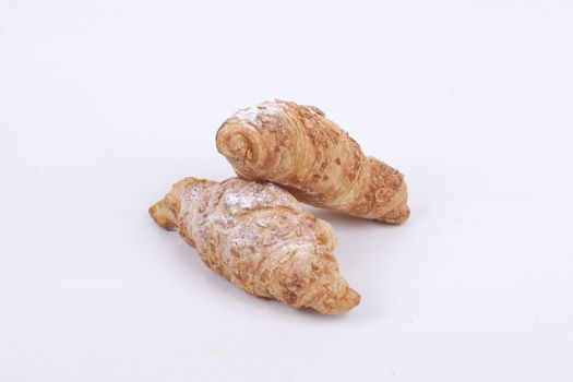 fresh almond croissant isolated on a white  background