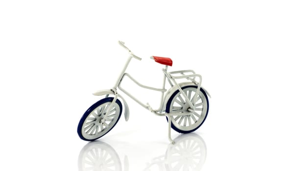 small white toy bike isolated on background