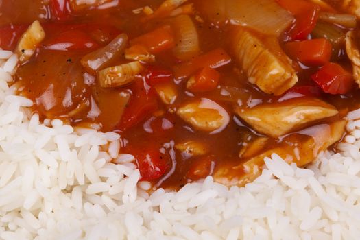 Closeup photo of chinese sweet and sour chicken with rice.