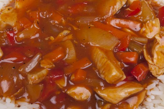 Closeup photo of chinese sweet and sour chicken with rice.