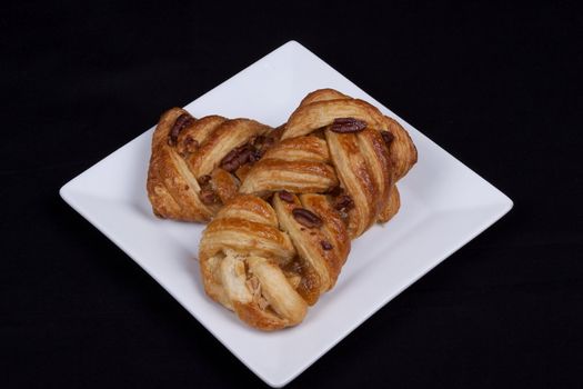 pecan and mapel pastries on a plate