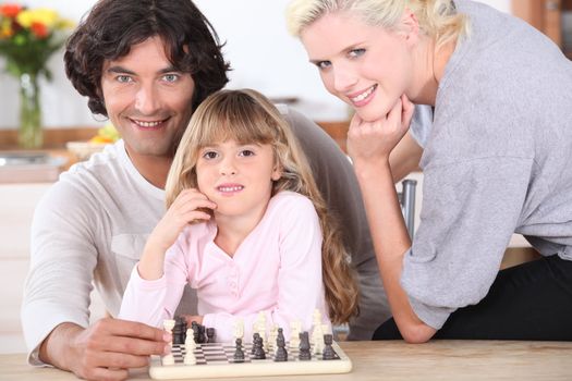 Family playing chess