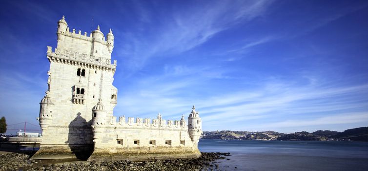 panoramic view of Tower of Belem with blue sky, Lisbon