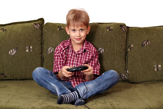 boy sitting on bed and play video game